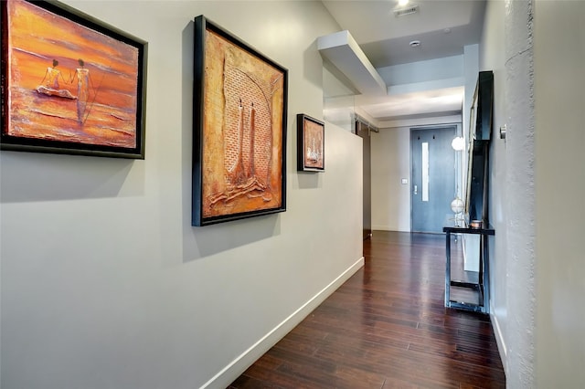 corridor featuring dark wood-type flooring