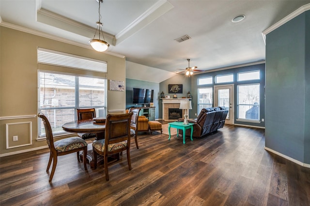 dining area with ceiling fan, a wealth of natural light, crown molding, and dark hardwood / wood-style floors