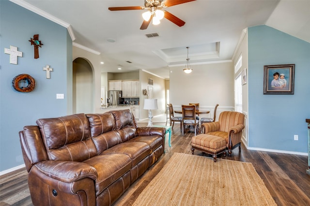 living room featuring ceiling fan, dark hardwood / wood-style floors, and crown molding