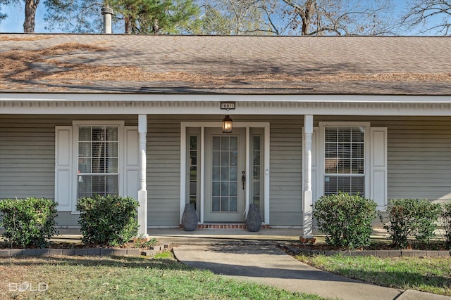 doorway to property featuring covered porch