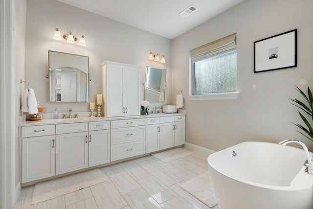 bathroom featuring a tub and vanity