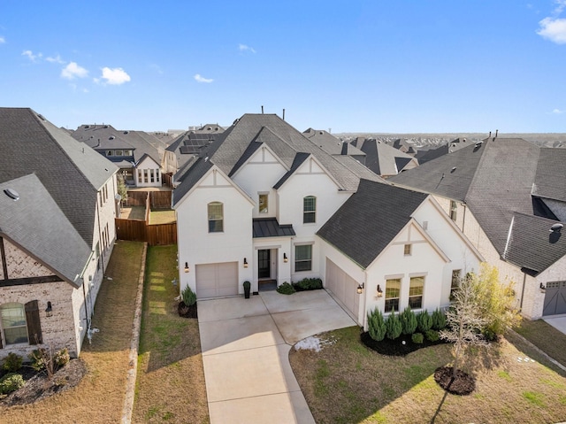 view of front of house featuring a garage and a front yard