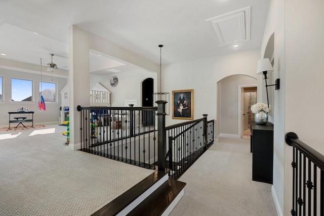 corridor with light colored carpet