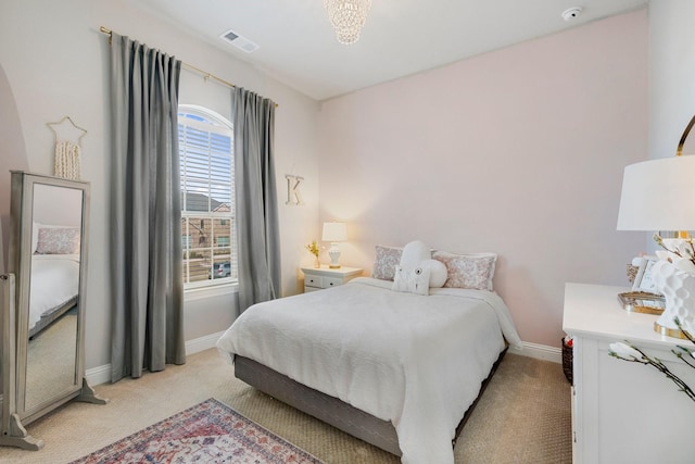 bedroom featuring light carpet