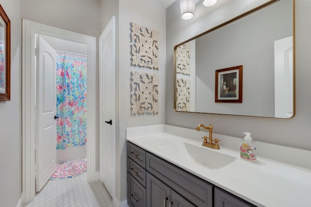 bathroom featuring tile patterned floors, vanity, and a shower with curtain