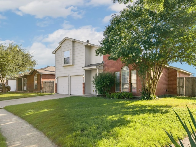 view of property featuring a garage and a front yard