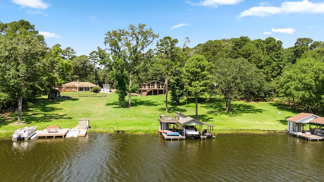 dock area featuring a water view and a lawn