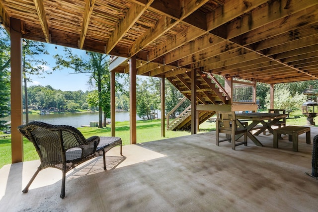 view of patio with a water view