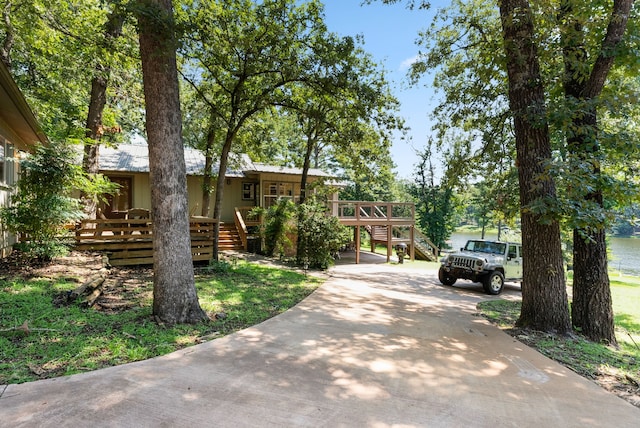 view of front facade with a wooden deck