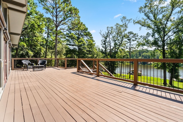 deck featuring a water view