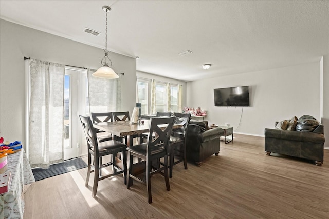 dining area featuring hardwood / wood-style floors