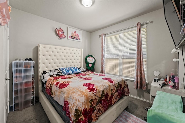 bedroom featuring dark colored carpet