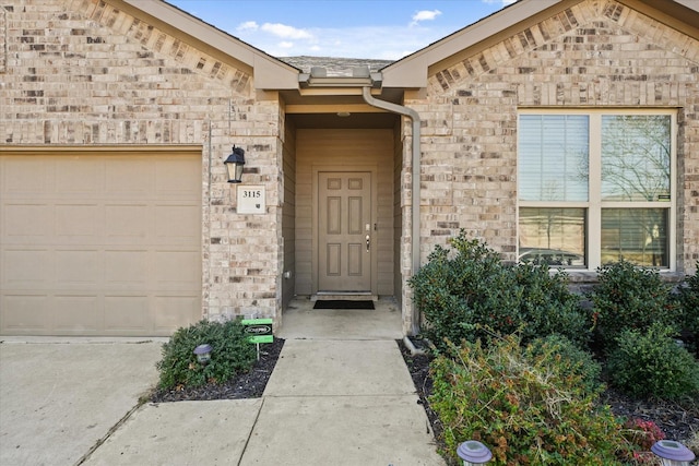 doorway to property featuring a garage