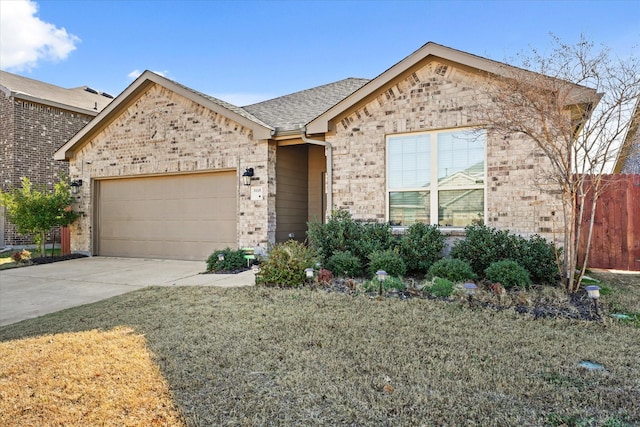 view of front of home with a garage and a front yard