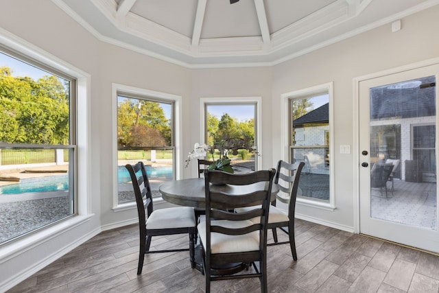 sunroom / solarium featuring beamed ceiling