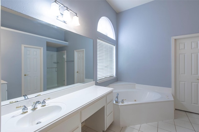 bathroom featuring shower with separate bathtub, tile patterned floors, and vanity