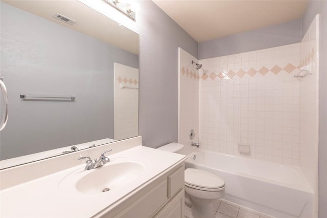 full bathroom featuring tile patterned floors, toilet, vanity, and tiled shower / bath