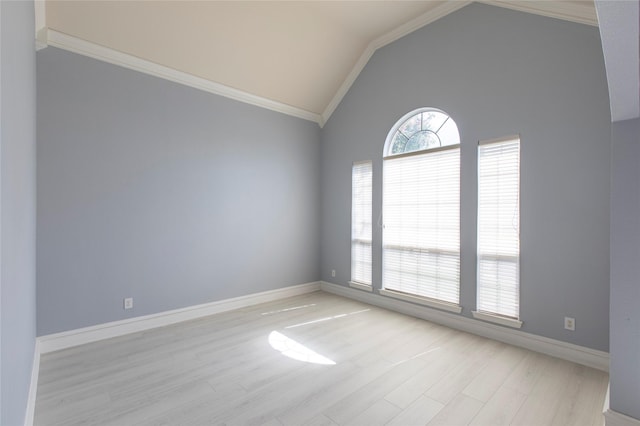 unfurnished room featuring vaulted ceiling, crown molding, and light wood-type flooring