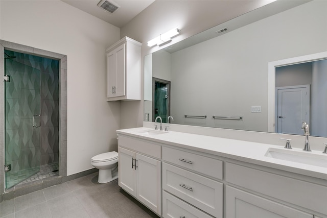 bathroom featuring a shower with door, tile patterned floors, vanity, and toilet