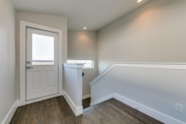 doorway to outside with dark hardwood / wood-style floors and plenty of natural light