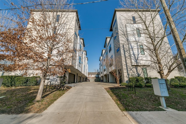 view of building exterior with driveway