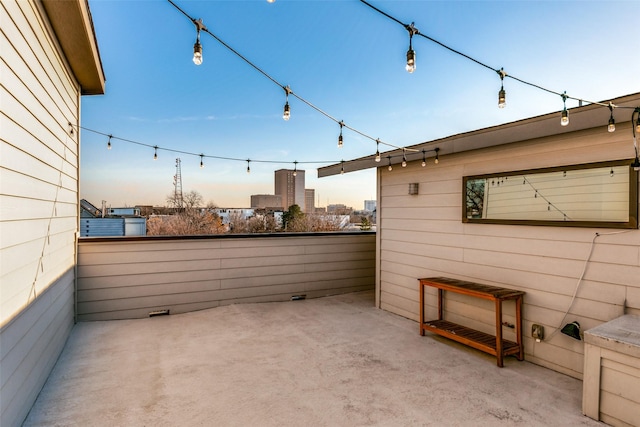 view of patio terrace at dusk