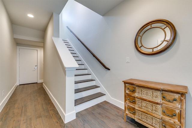 stairway featuring hardwood / wood-style floors