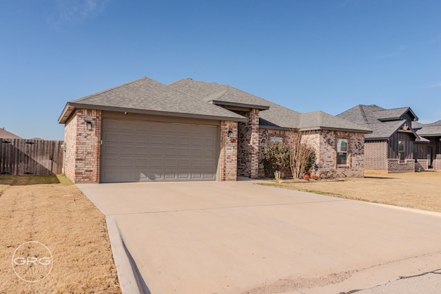 view of front of home with a front lawn and a garage