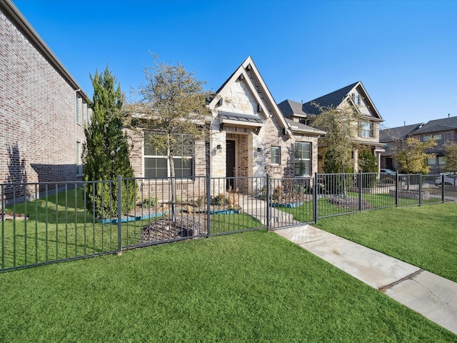 view of front of home featuring a front lawn