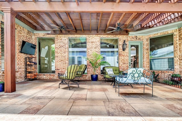 view of patio / terrace featuring ceiling fan and a pergola