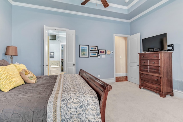 bedroom featuring ceiling fan, ensuite bath, light carpet, and ornamental molding