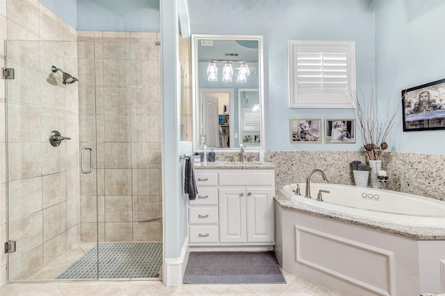 bathroom with shower with separate bathtub, tile patterned floors, and vanity