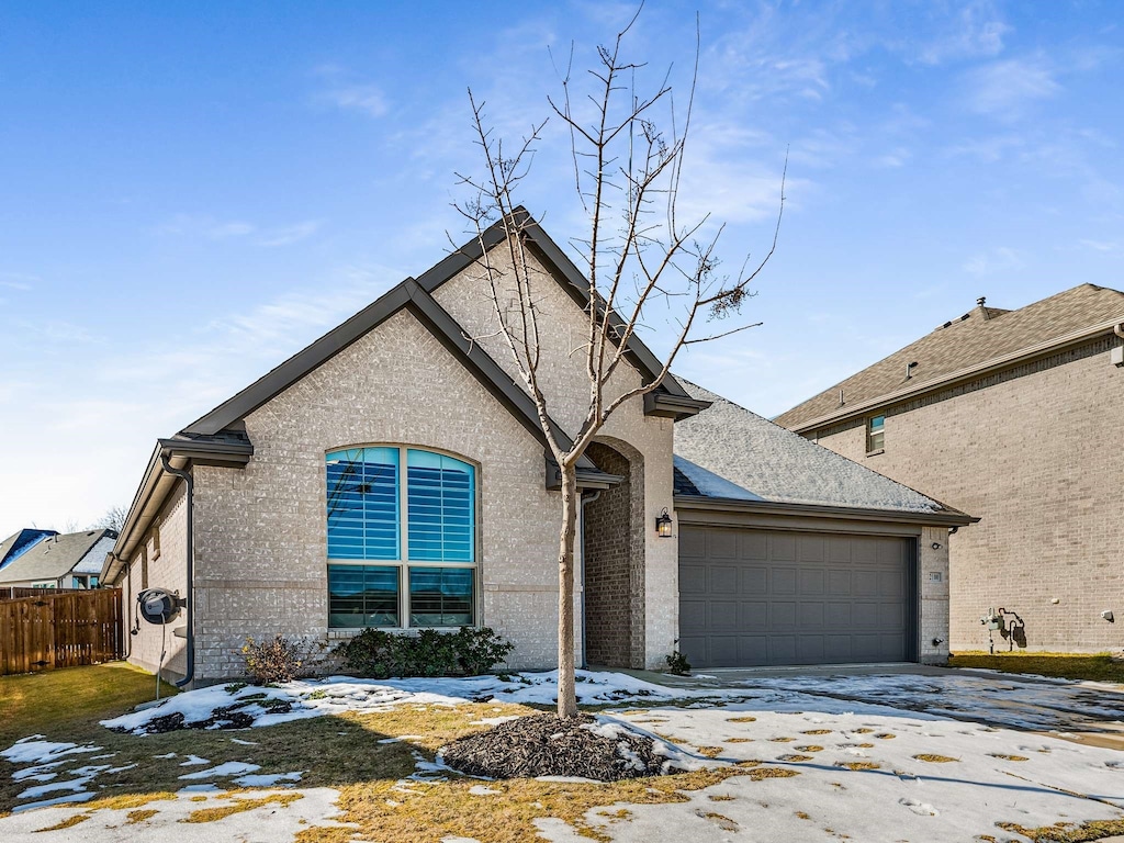 view of front of property featuring a garage