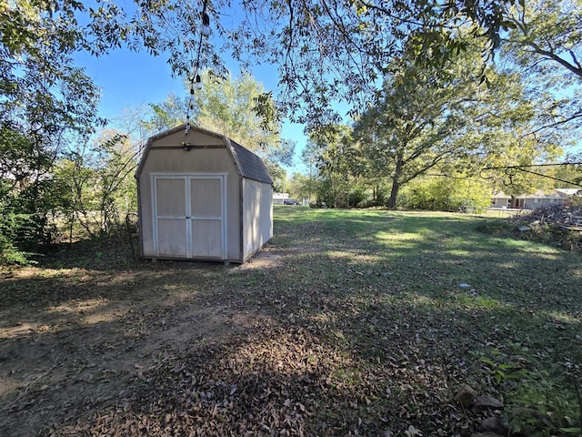 view of outdoor structure with a lawn