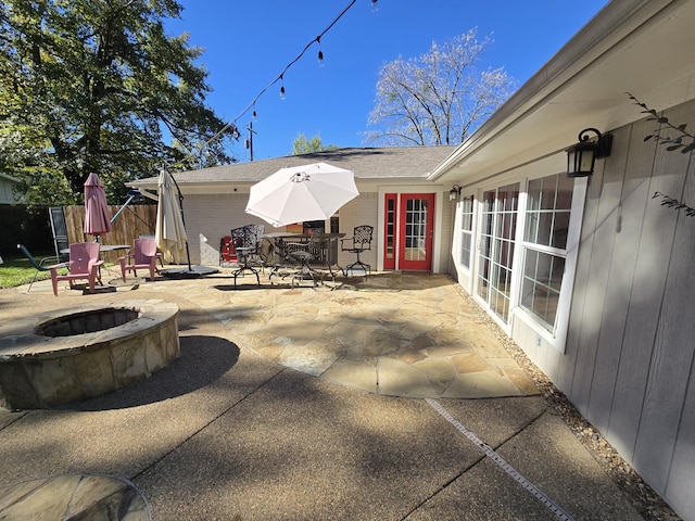 view of patio with a fire pit