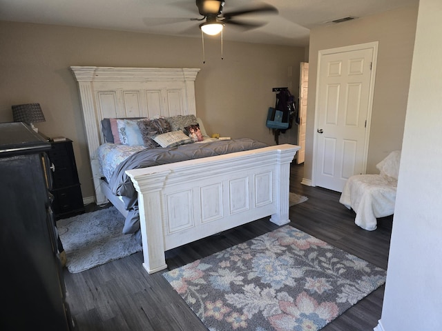 bedroom with ceiling fan and dark hardwood / wood-style flooring