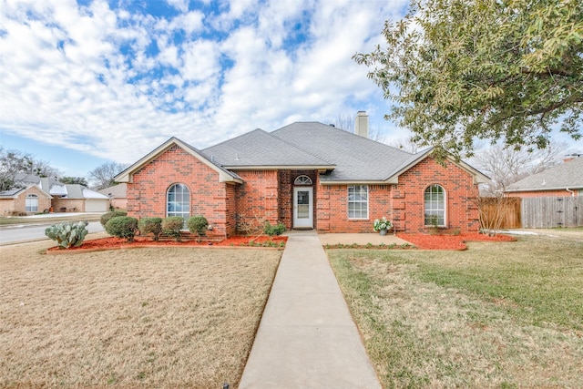 ranch-style home with a front yard