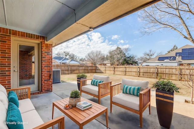 view of patio featuring central AC unit and an outdoor living space