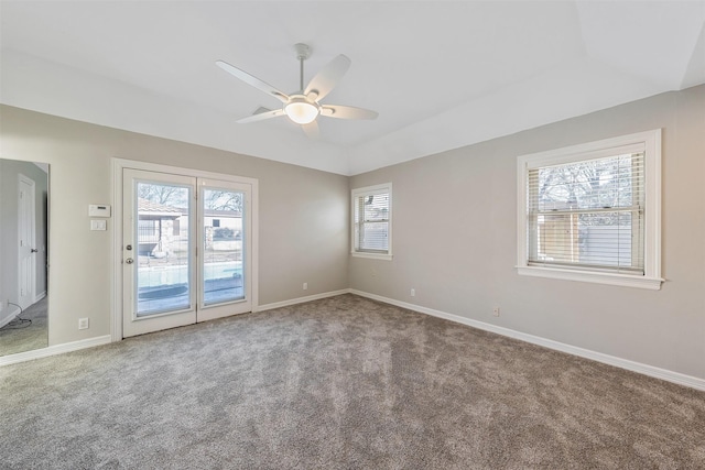 carpeted empty room featuring ceiling fan