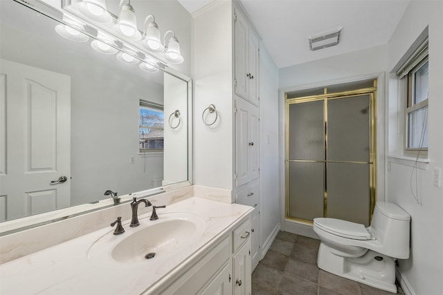 bathroom with a shower with shower door, toilet, and vanity