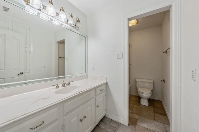 bathroom with toilet and vanity