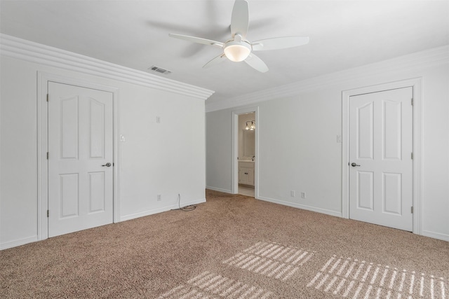 unfurnished bedroom with connected bathroom, ceiling fan, ornamental molding, and carpet