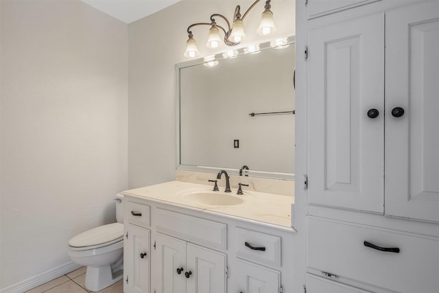 bathroom featuring toilet, tile patterned floors, and vanity