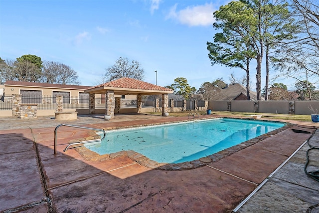 view of pool featuring a diving board, a patio area, and a gazebo