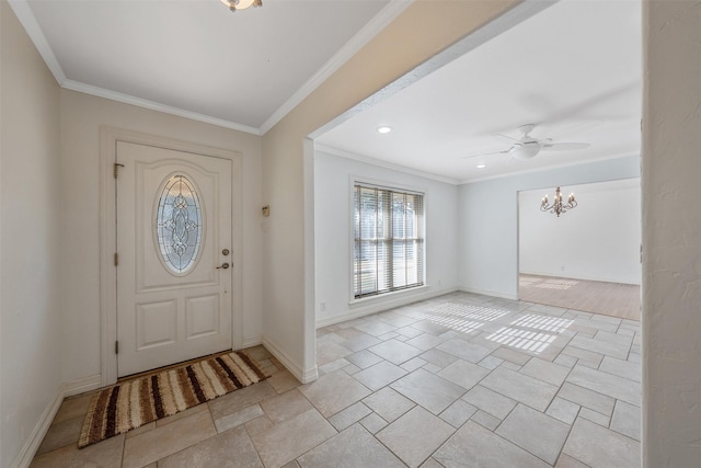 entryway with ceiling fan with notable chandelier and ornamental molding