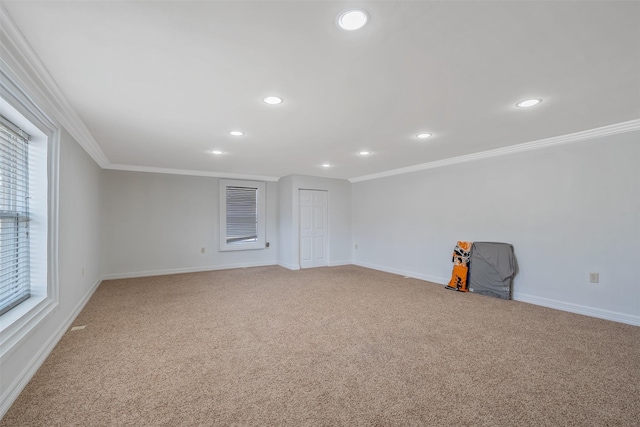 spare room with carpet floors and ornamental molding