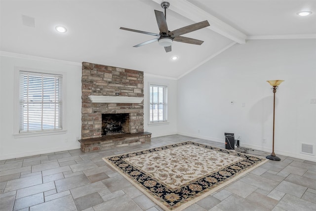 living room featuring ceiling fan, ornamental molding, a stone fireplace, and lofted ceiling with beams