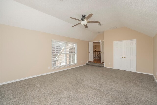 bedroom featuring ceiling fan, lofted ceiling, and dark carpet