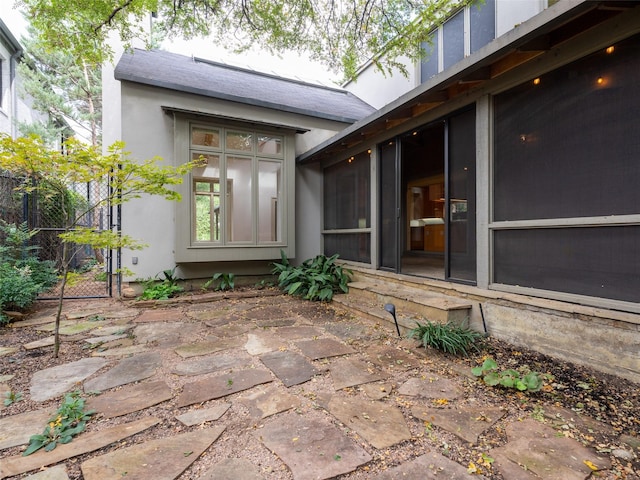 entrance to property featuring a patio area