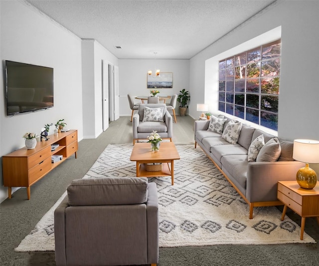 carpeted living room featuring a textured ceiling